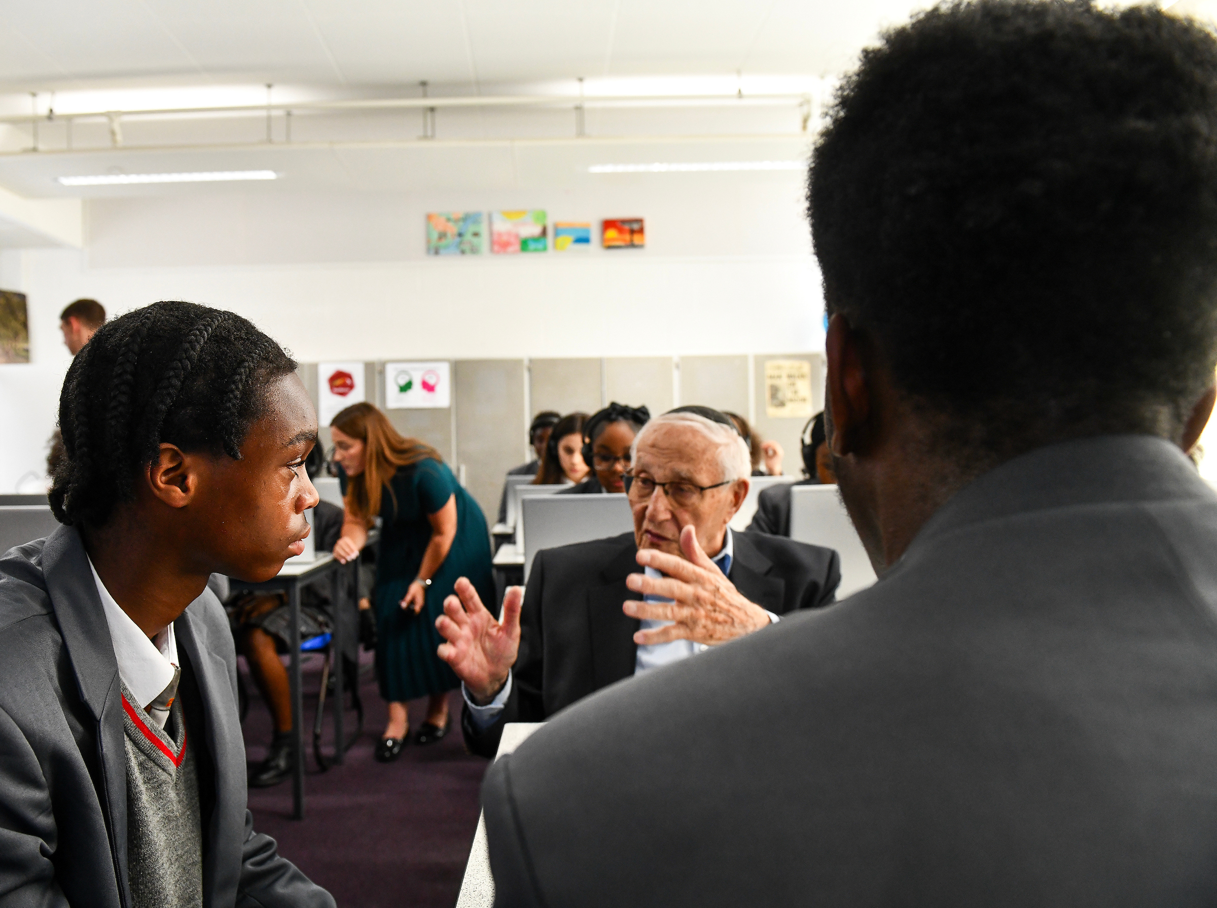 Students at Sacred Heart Catholic School listening to Manfred Goldberg, a holocaust survivor and the first survivor to feature in Testimony 360, a new interactive learning programme for delivering Holocaust education in UK schools. Photo: Holocaust